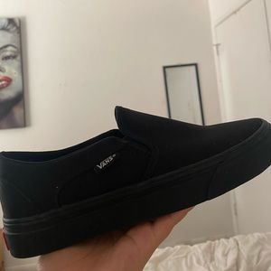 All black slip on vans